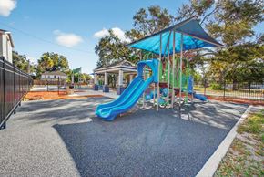 St. Petersburg apartment for rent - A playground with a blue slide and a blue canopy.