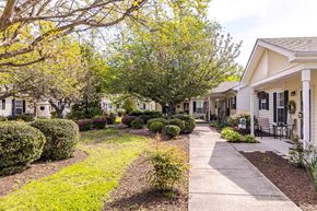 Colonial Heights apartment for rent - A row of houses with a sidewalk in front.