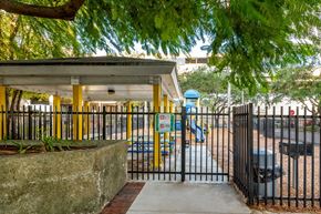 Miami apartment for rent - a park with a playground and a gated entrance