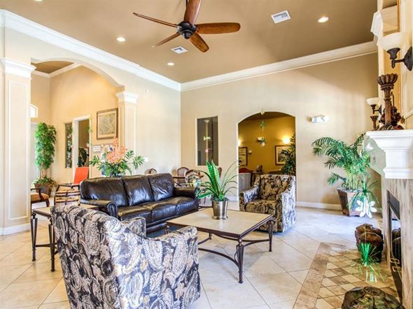 Punta Gorda apartment for rent - a living room filled with furniture and a ceiling fan
