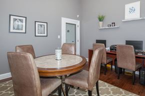 Columbia apartment for rent - a dining room with a table and chairs and a television at Carrington Place at Wildewood, South Carolina