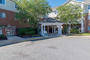 Fredericksburg apartment for rent - A building with a sign that says "Welcome" in front of it.