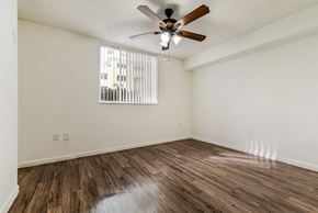 Miami apartment for rent - a bedroom with hardwood flooring and a ceiling fan