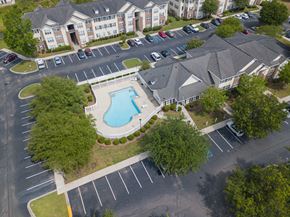 Ladson apartment for rent - an aerial view of the resort style pool and hot tub at the enclave at woodbridge apartments at Palms on Ashley River Apartments, Ladson, South Carolina