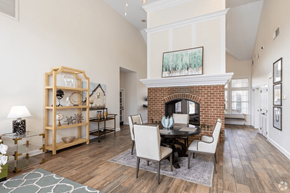 South Riding apartment for rent - A living room with a fireplace and a dining table.