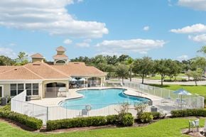 Ellenton apartment for rent - A large house with a pool in the backyard.