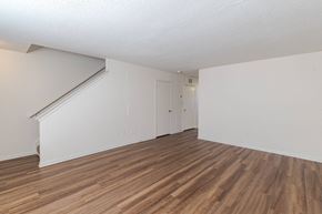 Fredericksburg townhouse for rent - A room with wooden flooring and white walls.at The Village at England Run, Virginia