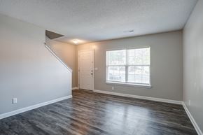 Rock Hill apartment for rent - A room with a wooden floor and a window with blinds.