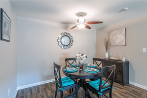 North Charleston apartment for rent - a dining room with a table and chairs and a ceiling fan at Bradley Square, North Charleston