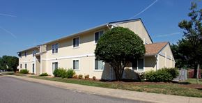 Richmond apartment for rent - a large house with a tree in front of it