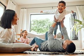 Bradenton apartment for rent - a family playing in their living room with a child on their