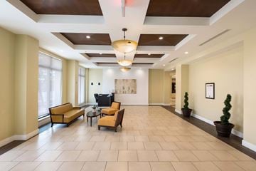 Miami apartment for rent - A spacious living room with a large sofa set and a television.