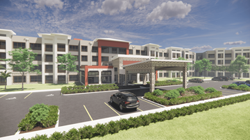 Bradenton apartment for rent - A black car is parked in a parking lot in front of a building.