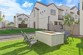 Phoenix townhouse for rent - a yard with a hot tub and chairs in front of a house
