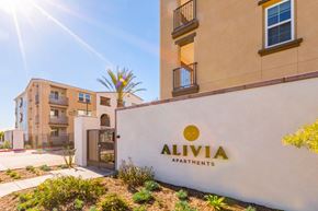 Whittier townhouse for rent - a building with an apartments logo on the side of it