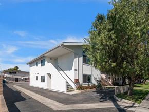 Westminster apartment for rent - a white building with a tree in front of it