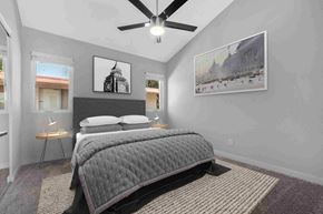 Westminster apartment for rent - a bedroom with a bed and a ceiling fan