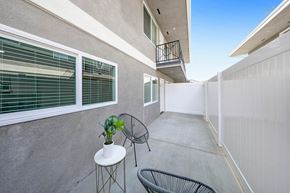 Westminster apartment for rent - a patio with two chairs and a small table