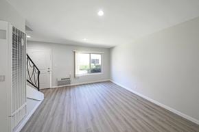 Azusa apartment for rent - a bedroom with hardwood floors and a large window