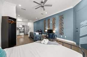 Tampa apartment for rent - a bedroom with a bed and a living room
