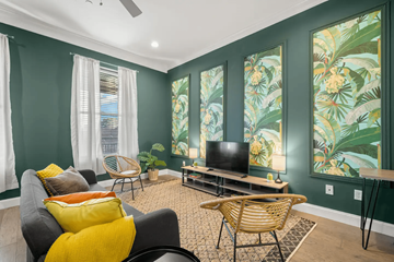 Tampa apartment for rent - A living room with a grey couch and a television.