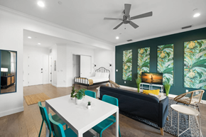 Tampa apartment for rent - a living room with a couch and a table and a ceiling fan
