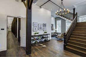 Tampa apartment for rent - the entryway of a house with a staircase and a chandelier