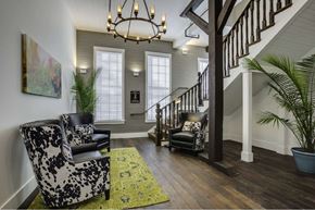 Tampa apartment for rent - a living room with two chairs and a staircase