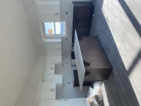 Hugo apartment for rent - A view of a staircase leading to a bedroom with a window.