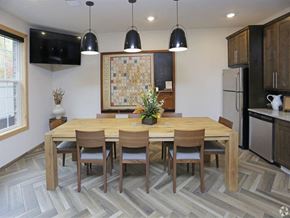 Forest Lake apartment for rent - a dining room with a wooden table and chairs at Arbor Ridge, Forest Lake, MN