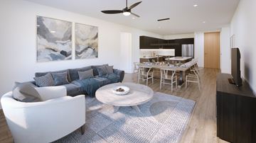 Sturgeon Lake apartment for rent - A modern living room with a white sofa and a grey rug.