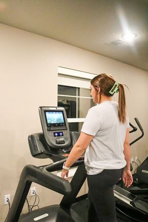 Forest Lake apartment for rent - a woman running on a treadmill at the gym  at Timber Ridge, Minnesota