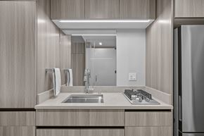 Salt Lake City apartment for rent - A modern kitchen with a stainless steel refrigerator and a double sink.
