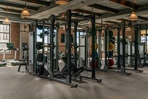 Salt Lake City apartment for rent - A gym with a variety of weightlifting equipment.