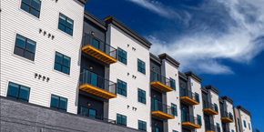 North Platte apartment for rent - A row of modern apartment buildings with balconies.