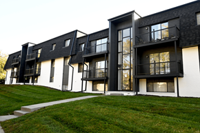 Omaha apartment for rent - A black and white building with balconies and windows.