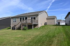 Gretna apartment for rent - A house with a deck and a garage.