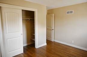 Omaha apartment for rent - A room with a white door and a white closet with a shelf.