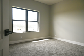 Gretna apartment for rent - A room with a carpeted floor and a large window.