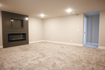Gretna apartment for rent - A living room with a fireplace and a flat screen TV.