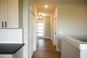 Gretna apartment for rent - A long hallway with white walls and wood floors.