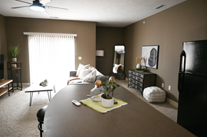 Grand Island apartment for rent - A dining room with a table set for two and a ceiling fan.