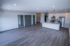 Valley apartment for rent - A kitchen with a white counter and a refrigerator.