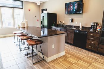 Open-concept kitchen, bar and social gathering areas