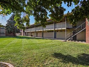 Kearney apartment for rent - A building with a green lawn in front of it.