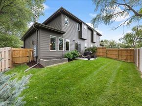 Omaha townhouse for rent - A house with a grey exterior and a green lawn.