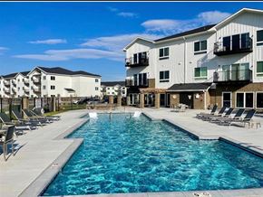 Valley apartment for rent - A swimming pool in front of apartment buildings at The Harbor.