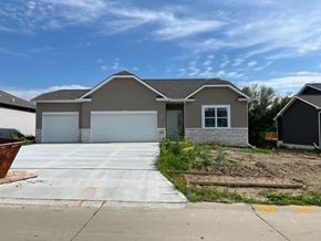 Gretna apartment for rent - A two-story house with a garage is situated in a residential area.