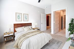 Gretna apartment for rent - A bedroom with a large bed and a ceiling fan.