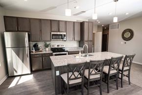 North Platte apartment for rent - A kitchen with a table and chairs.